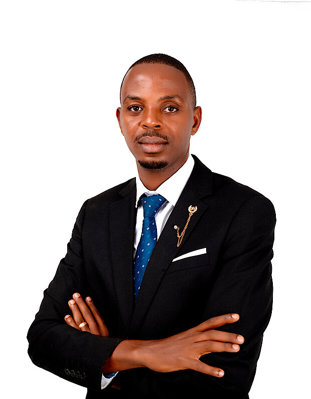 Marcel Sebahire wearing a white shirt and a black jacket